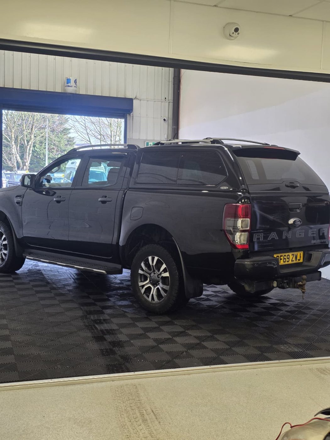Black Ford Ranger before vehicle graphics were applied